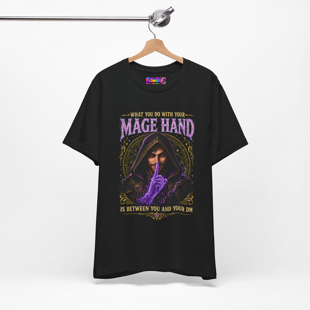 Mage Hand tabletop RPG graphic T-shirt, black shirt hanging from a wooden hanger.