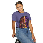 Girl Fight fantasy warrior duel graphic T-shirt, purple shirt modeled by a seated woman.