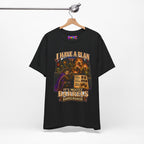 I Have a Plan Barrelmancer fantasy RPG graphic T-shirt, black shirt hanging from a wooden hanger.