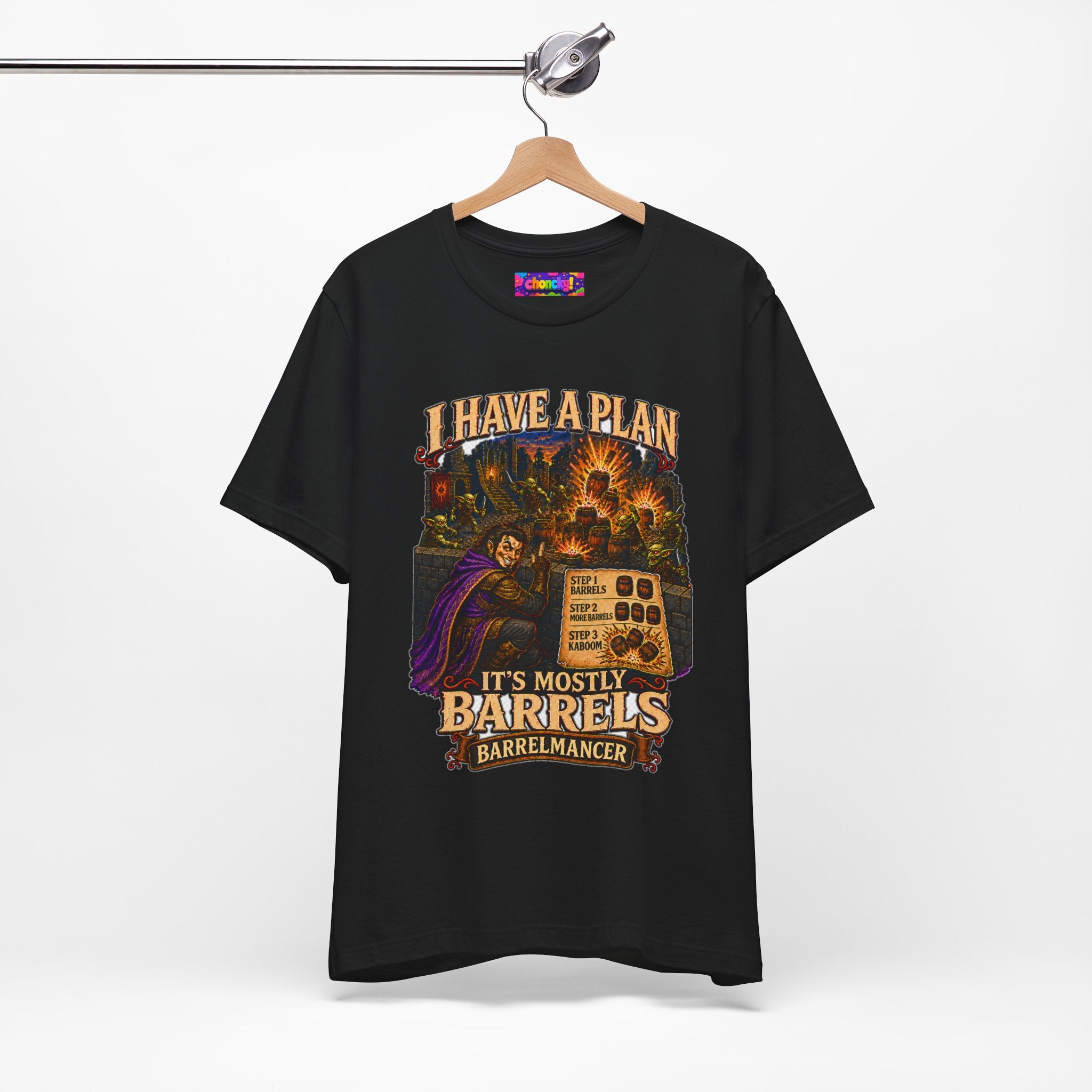 I Have a Plan Barrelmancer fantasy RPG graphic T-shirt, black shirt hanging from a wooden hanger.