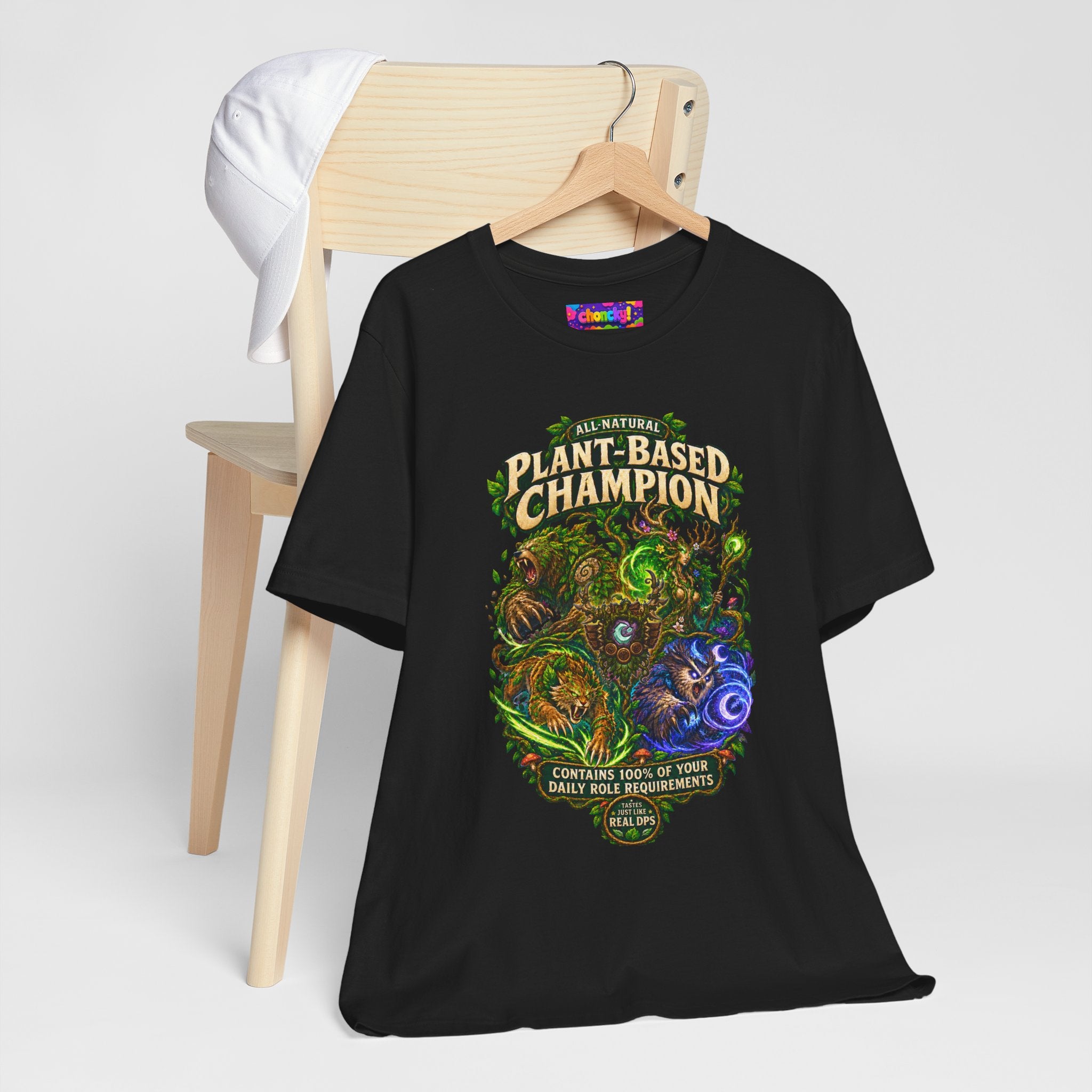 Plant-Based Champion fantasy druid graphic T-shirt, black shirt hanging beside a chair.