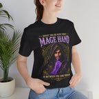 Mage Hand tabletop RPG graphic T-shirt, black shirt close-up on a woman in a casual room.