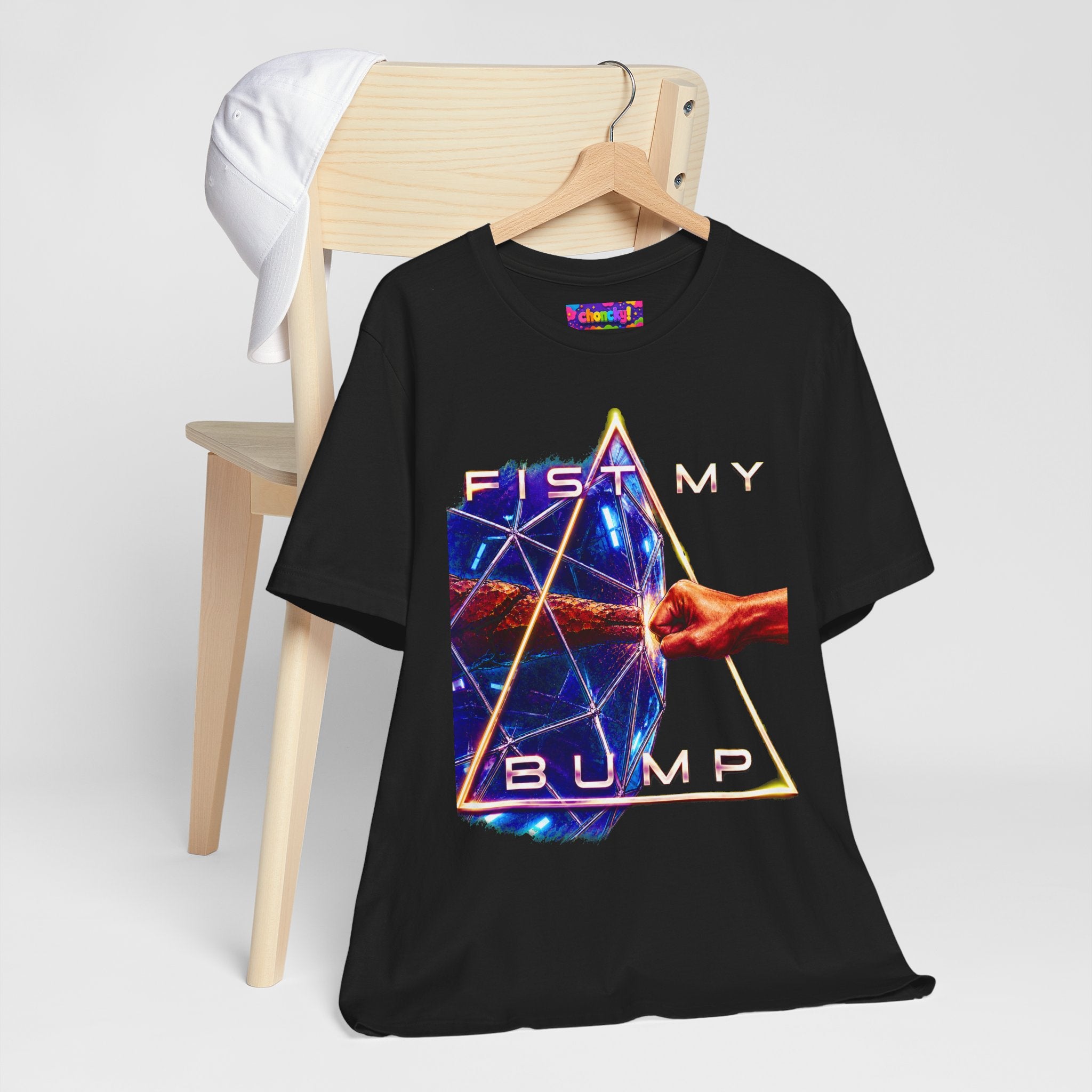 Fist My Bump Rocky and Grace sci-fi graphic T-shirt, black shirt hanging beside a chair.