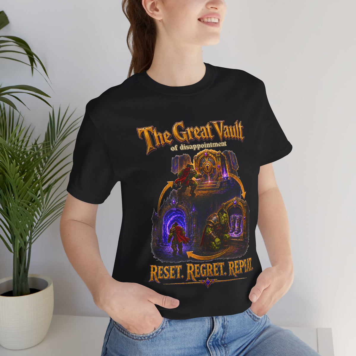 Great Vault Reset Regret Repeat fantasy MMO graphic T-shirt, black shirt close-up on a woman in a casual room.