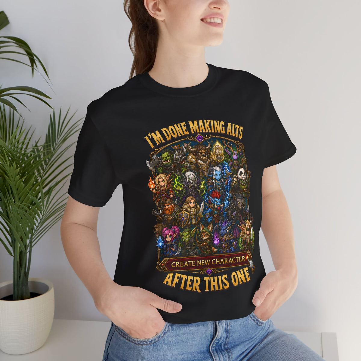 I'm Done Making Alts After This One fantasy MMO graphic T-shirt, black shirt close-up on a woman in a casual room.